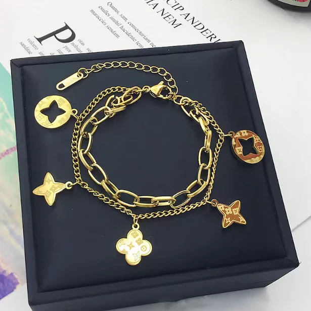 FOUR LEAF CLOVER CHARMS BRACELET - GOLD AND SILVER - Image 8